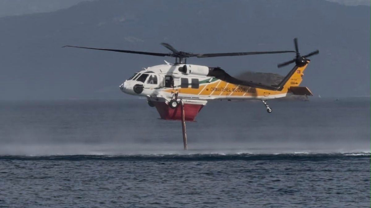 Muğla'daki orman yangınına havadan yoğun müdahale: Helikopterler peş peşe su attı
